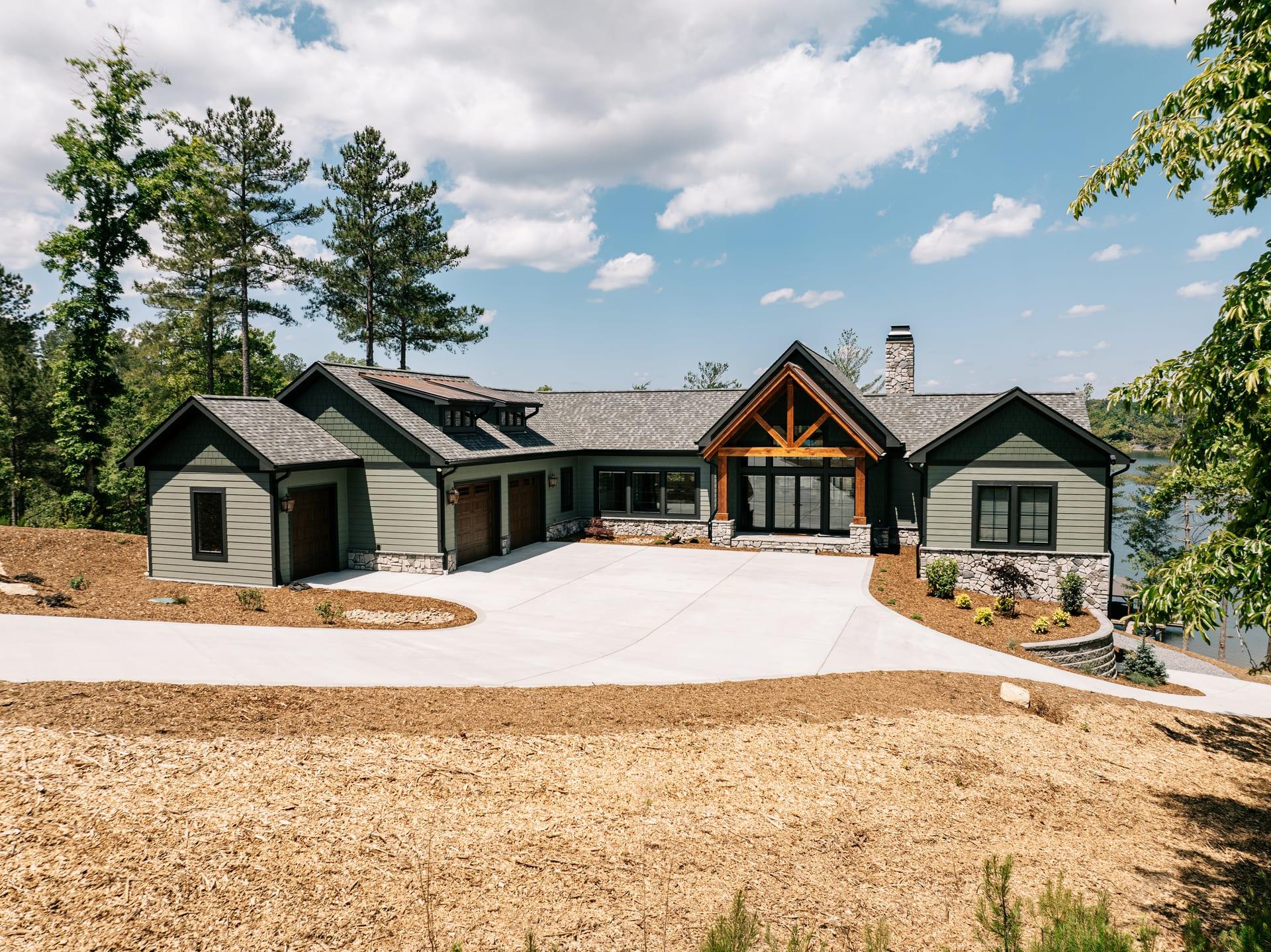 Aerial view of a JCM custom home with stone, timber-frame, and craftsman detailing