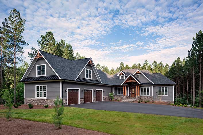 Gray and natural wood custom home exteriot